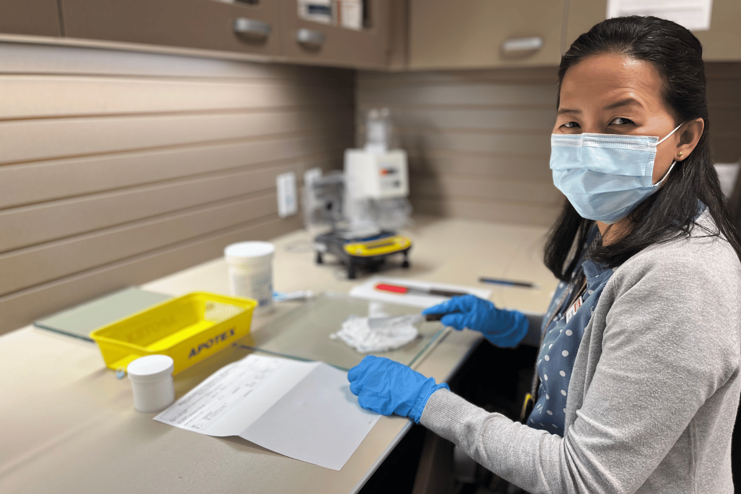 pharmacy assistant mixing up prescription cream